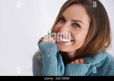 Im ready for warm clothes and cold nights. Portrait of young woman wearing winter clothing. Stock Photo