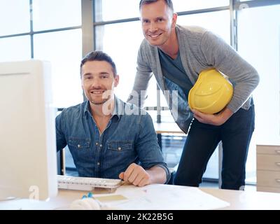Ready to turn your dream home into a reality. Portrait of two handsome architects working together in their office. Stock Photo
