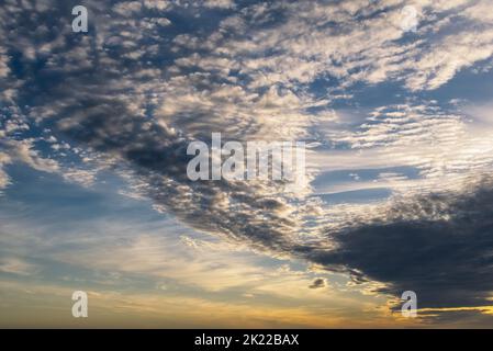 Interesting cloud formation at the sunset. Stock Photo
