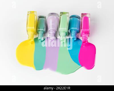 Forget playing it safe, be daring. Isolated shot of multiple colors of nailpolish. Stock Photo