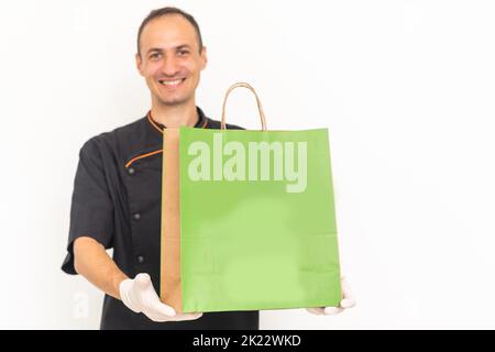Food delivery in the restaurant. The chef packs food Stock Photo