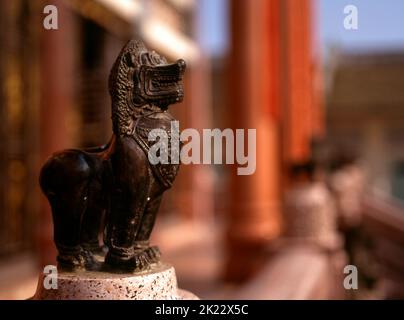 Thailand: Decorative singha (mythical lion) adorning the main viharn (assembly hall), Wat Pho Maen Khunaram, Bangkok. Wat Pho Maen Khunaram is a Mahayana Buddhist temple built in 1959. It mixes Thai, Chinese and Tibetan architectural styles. Stock Photo