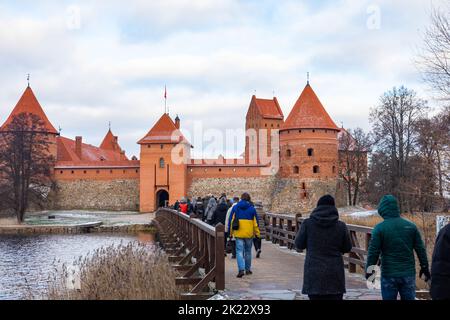 Trakai, Vilnius, Lithuania -  December 29, 2019: tourists entering the medieval Trakai Castle near Vilnius Stock Photo