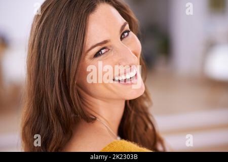Life is good. Portrait of an attractive woman looking over her shoulder. Stock Photo