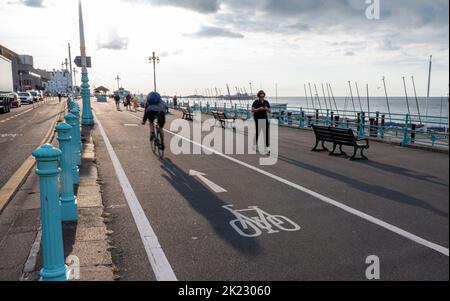 Brighton UK 22nd September 2022 - Cyclists travel along Brighton seafront on Car Free Day . Car Free Day is celebrated across the world on or around 22 September and encourages people to walk, cycle or use public transport, instead of using their car for the day.  . : Credit Simon Dack / Alamy Live News Stock Photo