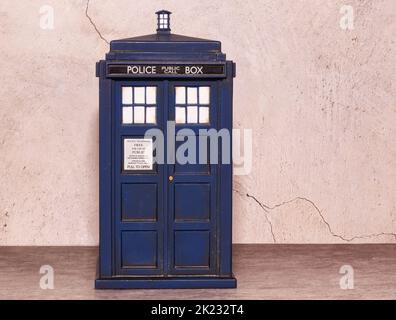 Police call box notebook isolated on wall background. Tardis from Doctor Who. Space for text. Stock Photo