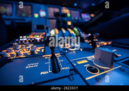 Pictures of a night flight of an Airbus 320 inside the cockpit. Different focus points of the instruments. On the right side the trim wheel and straig Stock Photo