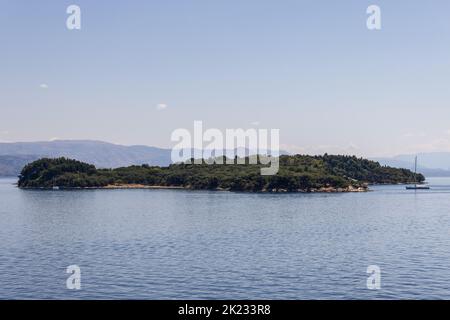 Protected nature reserve wooded uninhabited Ptichia island is located in the bay opposite Corfu Town, Ionian islands, Greece Stock Photo