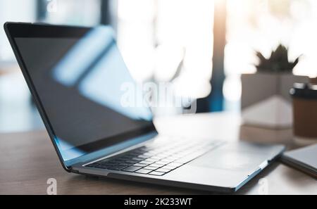 Laptop on a desk in modern office to work on a project, virtual business meeting or online research. Closeup of a computer, technology and pc on a Stock Photo