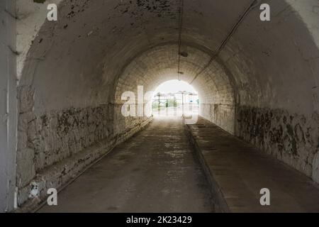 Dark tunnel under highway to beach.Spain. Stock Photo
