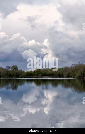 A view across the lake at the Neigh Bridge Country Park, one of the many lakes that make up the Cotswold Water Park Stock Photo