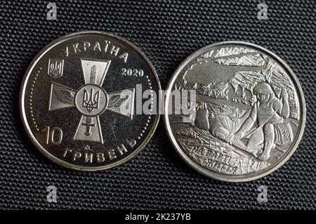 Ukrainian coins - war period limited edition 2020. Translation - Ukraine, ten hryvnia, on guard of life. Stock Photo