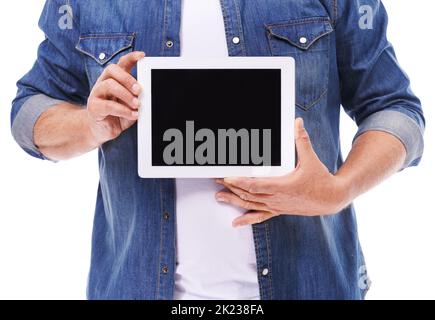 Check out my new website. Studio shot of a man holding up a digital tablet isolated on white. Stock Photo