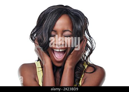 Sometimes you just have to yell. Studio shot of young woman yellingisolated on white. Stock Photo