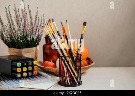 Drawing painting background. Colorful paints, brushes, stationery, supplies for drawing and craft. Creative education setting, artist desk top view Stock Photo