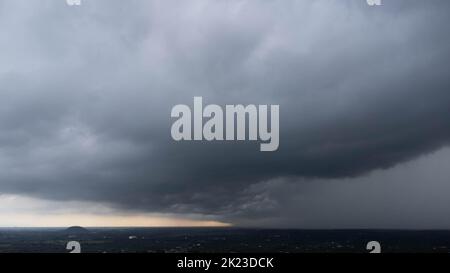 Aerial view of dark sky clouds background. Dark gray storm clouds before the storm. Beautiful nature of storm clouds in the daytime. Horrible weather Stock Photo