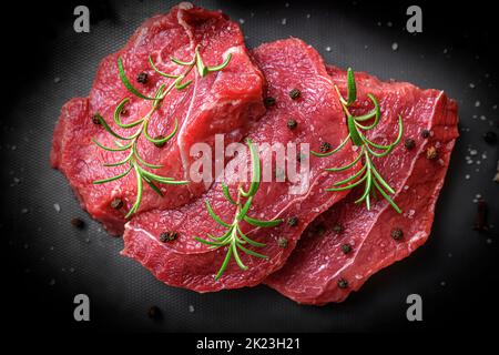 Red raw meat on a cutting board. Stock Photo