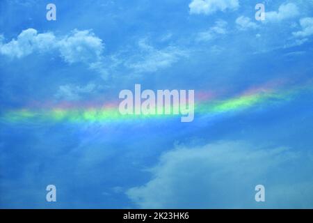 A circumzenithal arc is an optical effect which looks like an upside down rainbow. Seen here in Colorado, USA Stock Photo