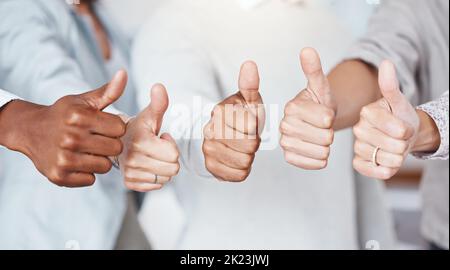 Thumbs up, diversity and a yes sign by business people in a startup company or successful marketing agency. Hands, collaboration and team of workers Stock Photo