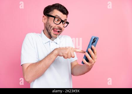 Photo of curious ceo guy manager use smart gadget try new web application touch screen isolated on pastel color background Stock Photo