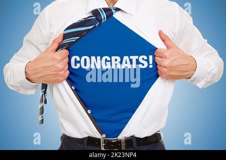 Businessman shows lettering Congrats! under shirt as concept Stock Photo