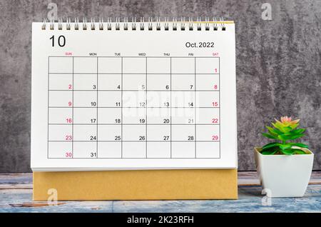 October 2022 Monthly desk calendar for 2022 year on wooden table. Stock Photo