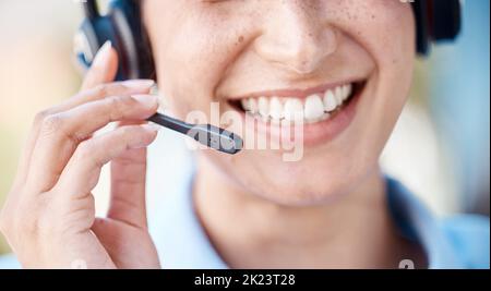 Call center face, woman headset for communication and discussion with clients online at telemarketing company, working in crm business and consulting Stock Photo
