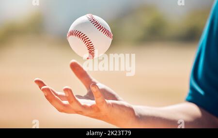 Sports athlete catch baseball with hand on playing game or training practice match for exercise or cardio at stadium field. Young man, fitness and Stock Photo