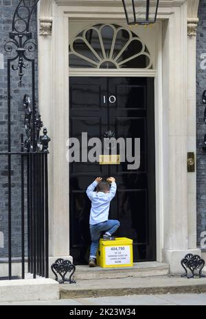 London, UK. 22nd Sep, 2022. Young Kingsley hands in a petition signed by over 400,000 people at 10 Downing Street on behalf on a range of anti-poverty and childrens charites, organised by 38 Degrees, demanding Government action on the cost of living Credit: Phil Robinson/Alamy Live News