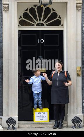 London, UK. 22nd Sep, 2022. Young Kingsley hands in a petition signed by over 400,000 people at 10 Downing Street on behalf on a range of anti-poverty and childrens charites, organised by 38 Degrees, demanding Government action on the cost of living Credit: Phil Robinson/Alamy Live News