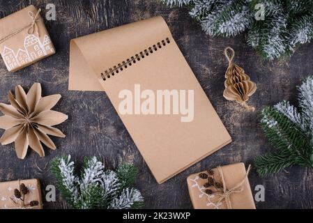 Christmas composition with empty craft notebook Stock Photo
