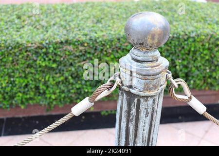 pole with metal restraining rope. Barrier, enclosed VIP area, protected ...