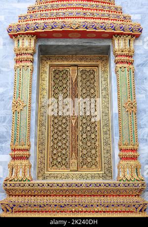 Beautiful Ancient Temple door painting and carving on wood, Thailand. Stock Photo