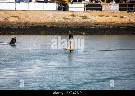 eFoil surfing at the Southampton boat show in Southampton, UK Stock Photo