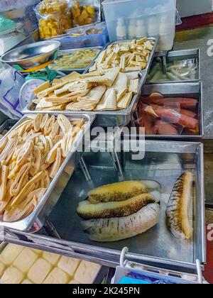 Disgusting unfamiliar Thai food and Chinese cuisine in street food market in China Town Bangkok Thailand. Stock Photo