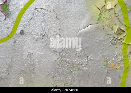 Colorful wall background with damaged paints of gray silver and yellow. Stock Photo