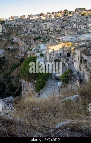 VMatera, Italy - September 14, 2019: View of the Sassi di Matera a historic district in the city of Matera, well-known for their ancient cave dwelling Stock Photo