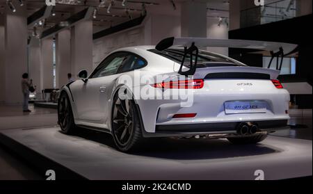 A picture of the rear view of the Porsche 911 GT3 RS, captured in an auto shop in Berlin. Stock Photo