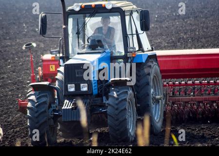 Russia, Temryuk - 15 July 2015: Tractor. Agricultural machinery tractor. seeds in the soil Stock Photo