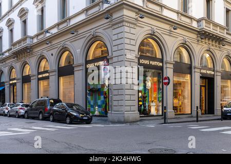 Exterior of the Louis Vuitton high-fashion store in the historic centre of  Florence with an old lady passing by bike, Tuscany, Italy Stock Photo -  Alamy
