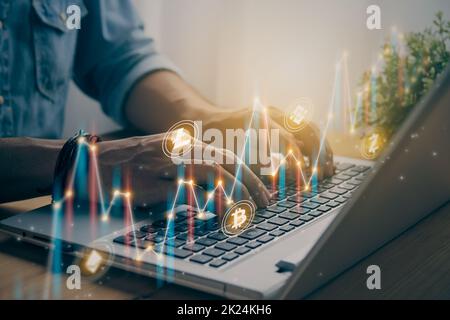 Casual Businessman Using and Typing Laptop Computer with Color Slant Cryptocurrency Market Bar Chart and Line Graph Trend Image. Financial Economy and Stock Photo