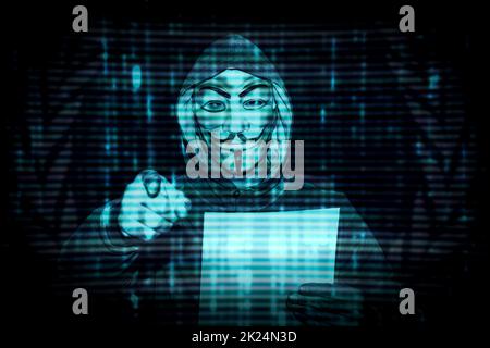 Milan, Italy. February 28th, 2022. Man with a mask from the decentralized group of activists anonymous hackers issues a statement against Putin about Stock Photo