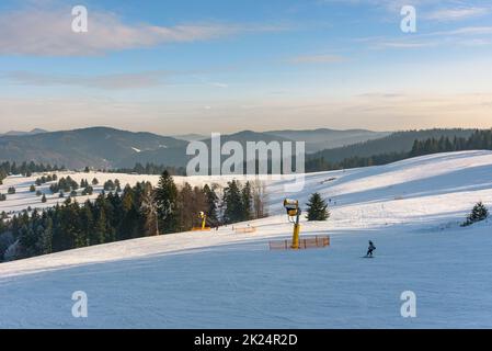 Panoramic winter view of Beskid Sadecki mountains from ski slope in Krynica Zdroj, Poland Stock Photo