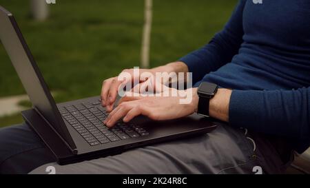 Young businessman hands busy working on laptop or computer keyboard for send emails and surf on a web browser. Using a laptop keyboard. Stock Photo