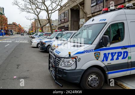 NYPD Different New York Police Department cars, trucks and vans parked next to each other at the street at a police station, Harlem, New York City, du Stock Photo