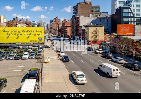 City Street in Chelsea with lots of traffic, trucks parked on the ...