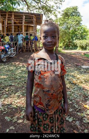 Cure - Jinka, Omo River Valley, Ethiopia - May 10, 2019: portrait of happy teenage girl with tangled hair braids in Cure near City Jinka, southwestern Stock Photo