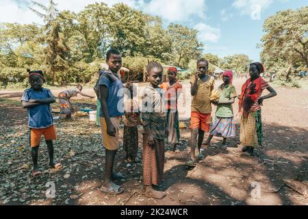 Cure - Jinka, Omo River Valley, Ethiopia - May 10, 2019: portrait of happy teenagers in Cure near city Jinka, southwestern Ethiopia. Africa Stock Photo