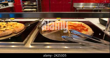 Dining Room Buffet aboard the abstract luxury cruise ship. Selective focus. pizza Stock Photo
