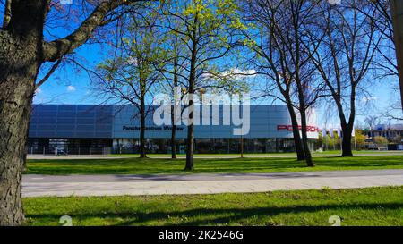 Wroclaw, Poland - April 18, 2022: Porsche AG, headquartered in Stuttgart, is a German automobile manufacturer specializing in high performance sports Stock Photo